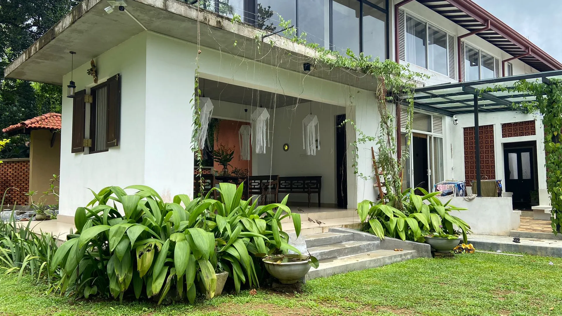 Goraka Villa exterior surrounded by a quiet tropical garden